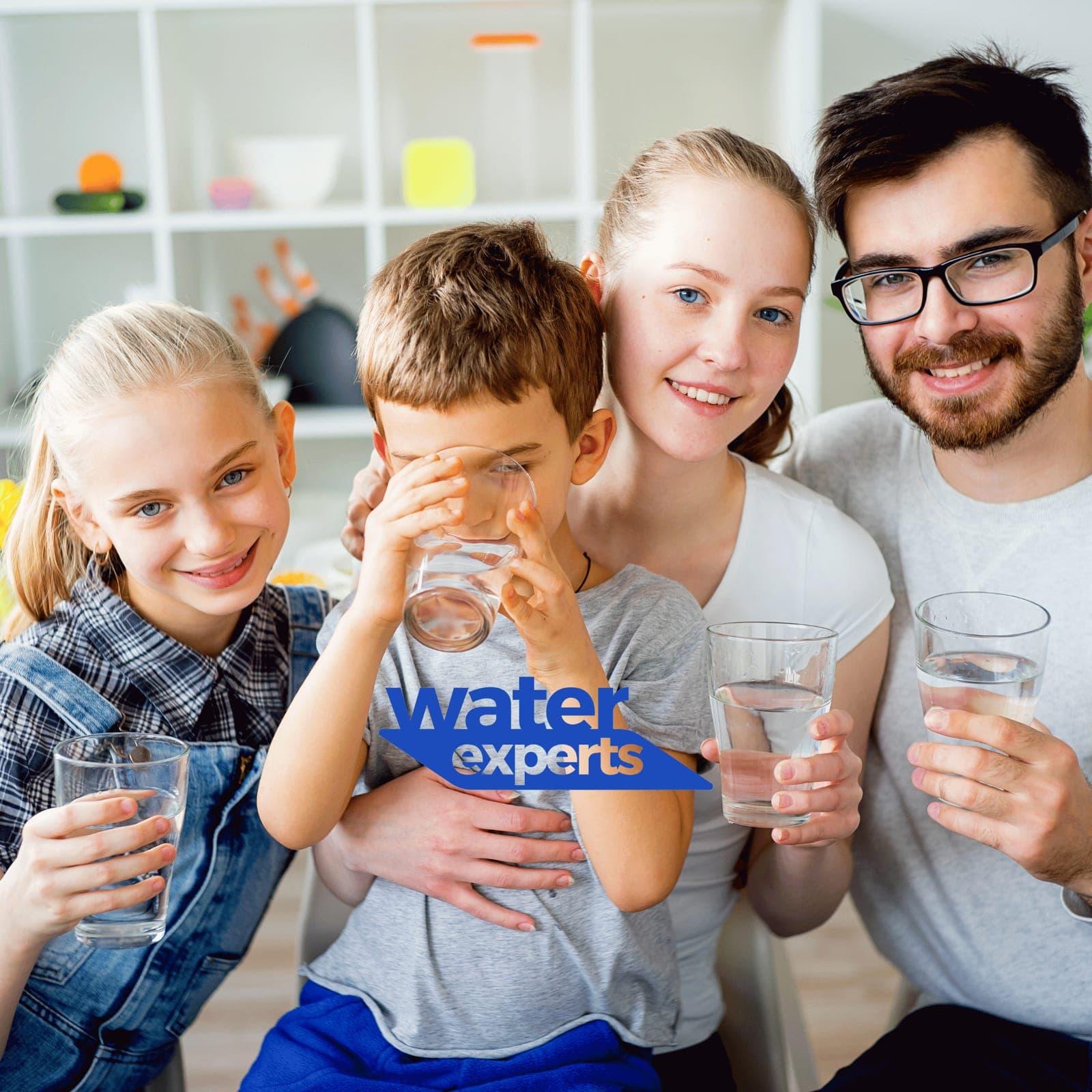 Happy, healthy family drinking clean water