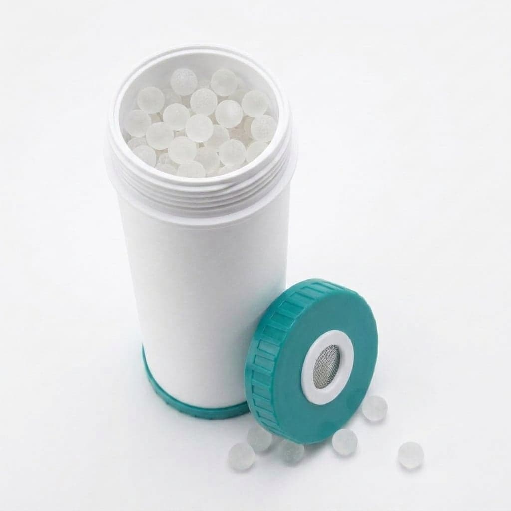 Refillable 20 inch cartridge shell with the cap off, filled with siliphos balls